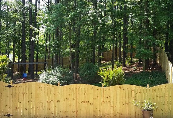 wooden fence with decorative top