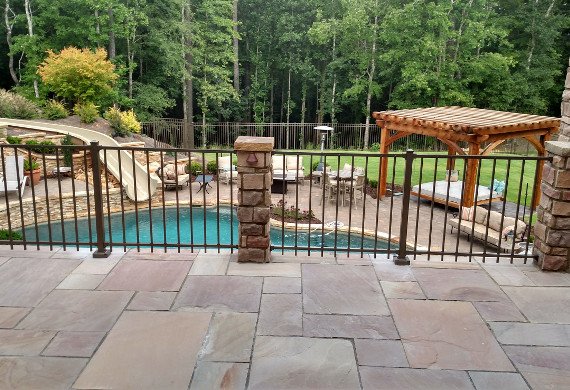 Patio railing with stonework and pool