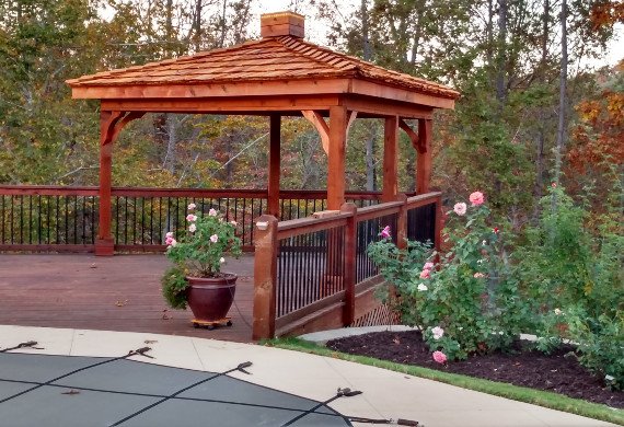 Patio railing with gazebo and pool