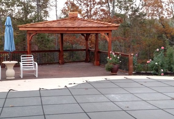 Patio railing with gazebo and pool